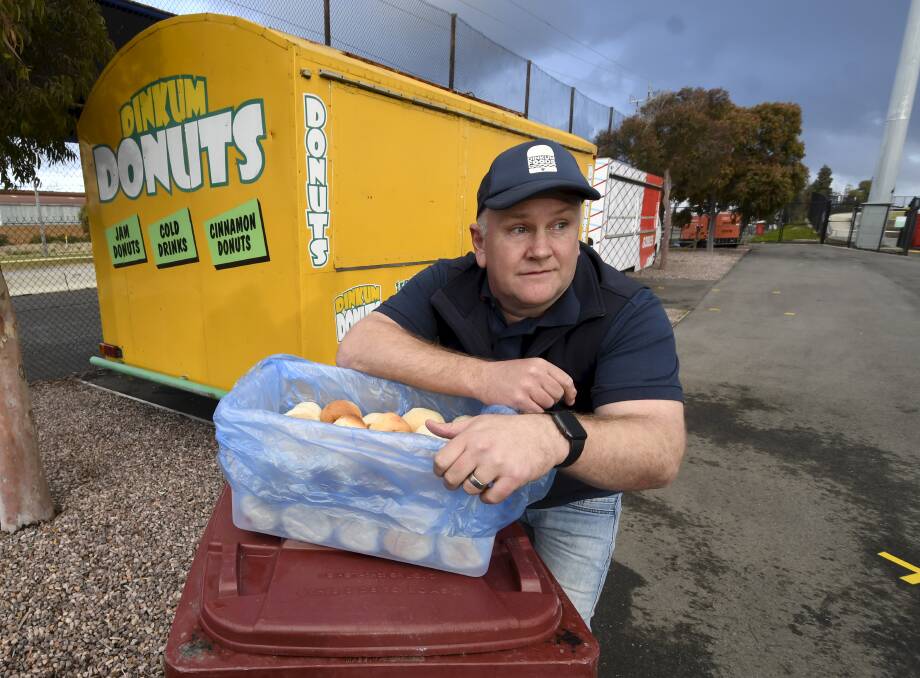 Dinkum Foods' Matt Pearce was left with 4000 doughnuts after the cancelled AFL game. Picture: Lachlan Bence