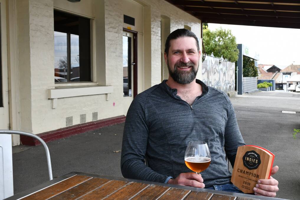 Champion: Dollar Bill Brewing's Ed Nolle enjoys a beer after winning the Champion Mixed Culture Beer at the Indies.