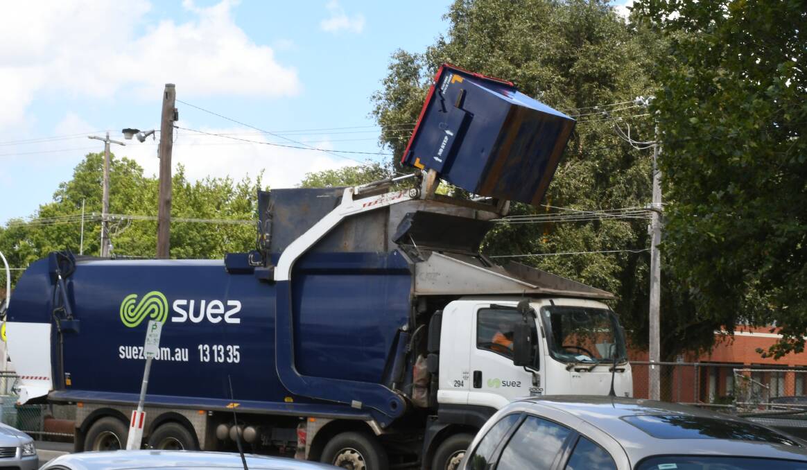 A truck collecting glass at the Eastwood Street car park.