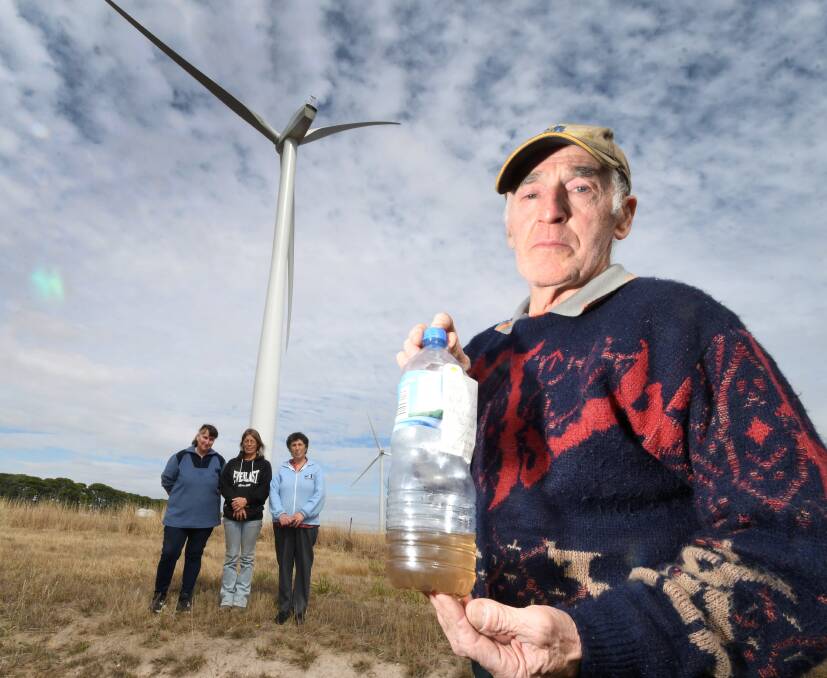 Mount Wallace resident Eddie Cassar with Janene Skidmore, Michelle Evans, and Mary Cassar at the nearby Yaloak South wind farm. Picture: Lachlan Bence