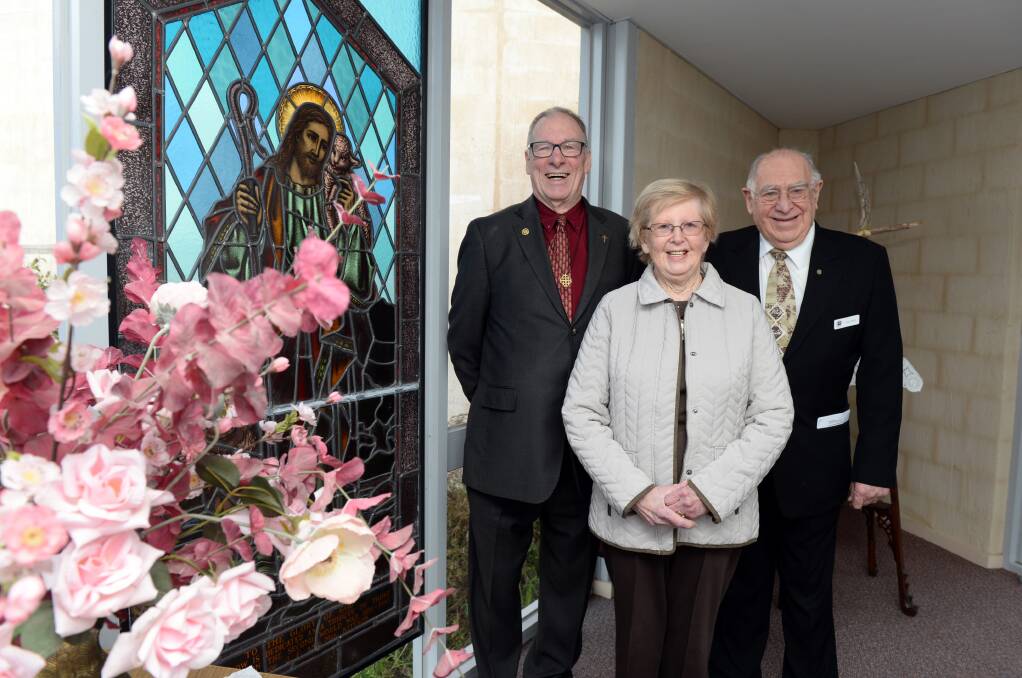 End days: Reverend Doctor Graeme Sutton, parishioner Kath Homberg, and church council chairman Alec Wood in front of the Wendouree Uniting Church's stained glass shepherd. Picture: Kate Healy