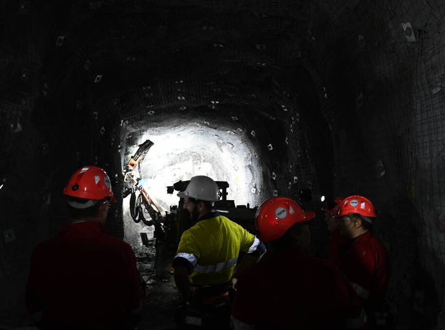 Underground: The tour group visits a 'jumbo' installing support bolts underneath Ballarat.