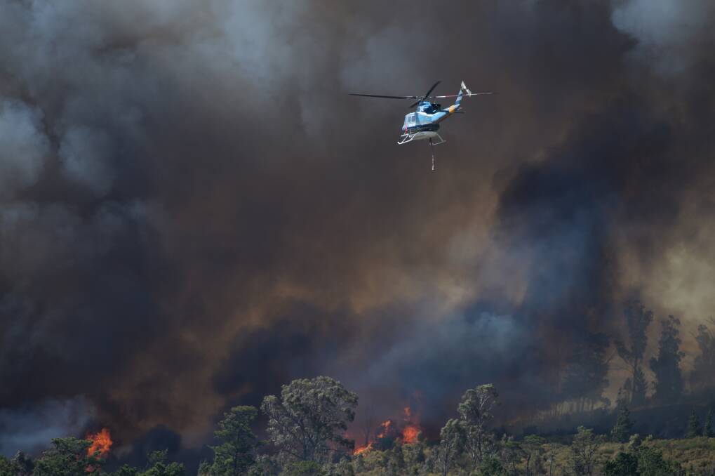 A waterbomber heads to the Mount Clear fire in April. Picture: Kate Healy