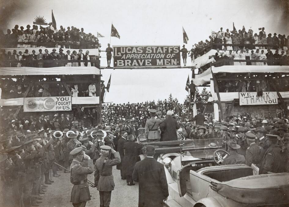 WELCOME HOME: E. Lucas and Company staff welcome back servicemen after World War 1 and lay the foundation stone for the Arch of Victory.