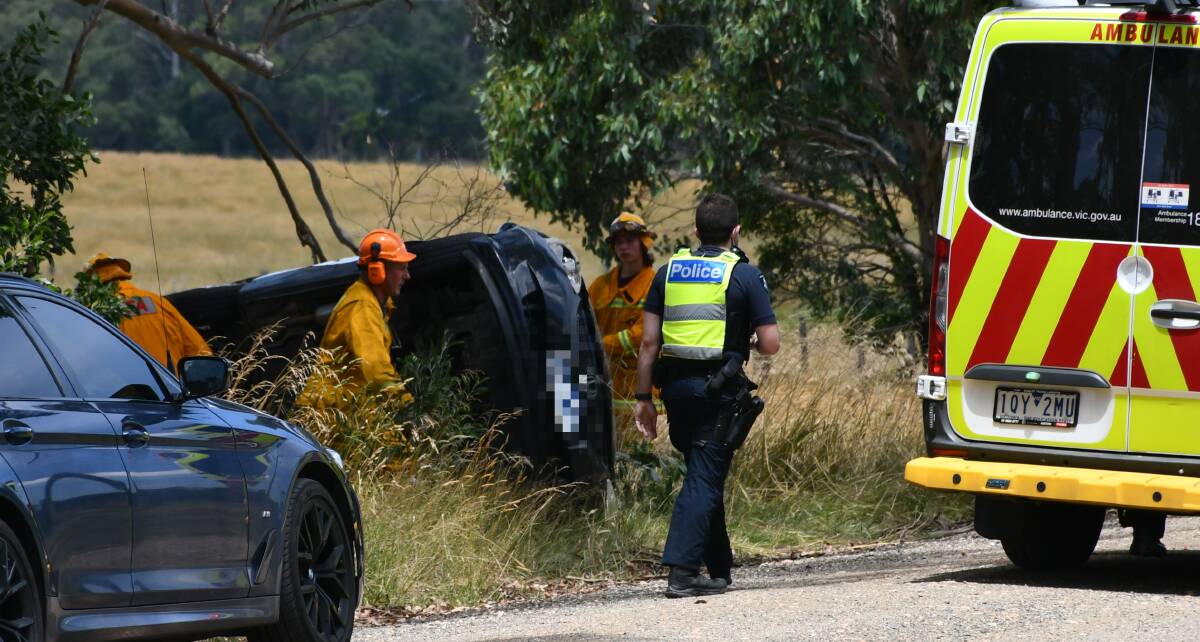 Emergency services investigate a car rollover near Navigators. Picture: The Courier