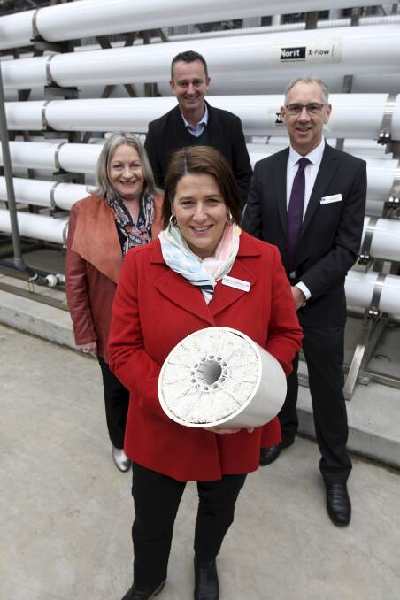 Wendouree MP Juliana Addison holds a cross-section of a filter pipe with CHW's Angeleen Jenkins and Jeff Haydon, with City of Ballarat mayor Daniel Moloney. Picture: Lachlan Bence