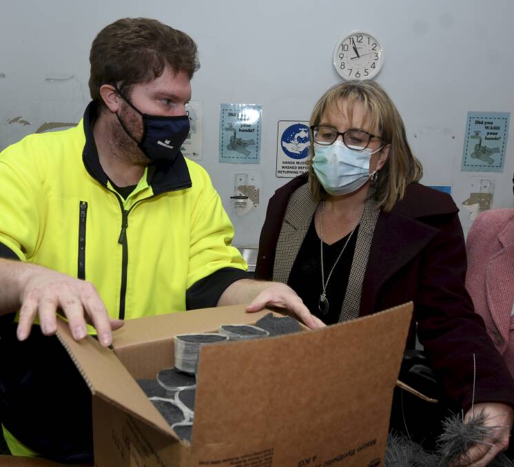 Helping out: McCallum's Paul Cornford and acting Premier Jacinta Allan check out eMesh being packed at Sturt Street. Picture: Lachlan Bence