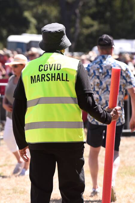 Keep your distance: COVID marshals were seen with pool noodles.