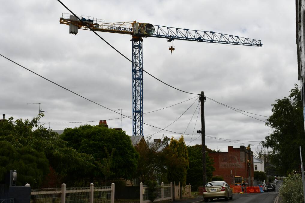 Up and away: The crane will remain in Davey Street as Nightingale construction gets under way. Pictures: The Courier
