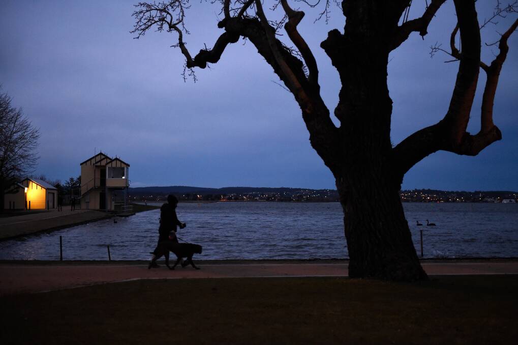 In the dark: Walking the dog around the lake after work in winter could be a bit brighter soon. Picture: Adam Trafford