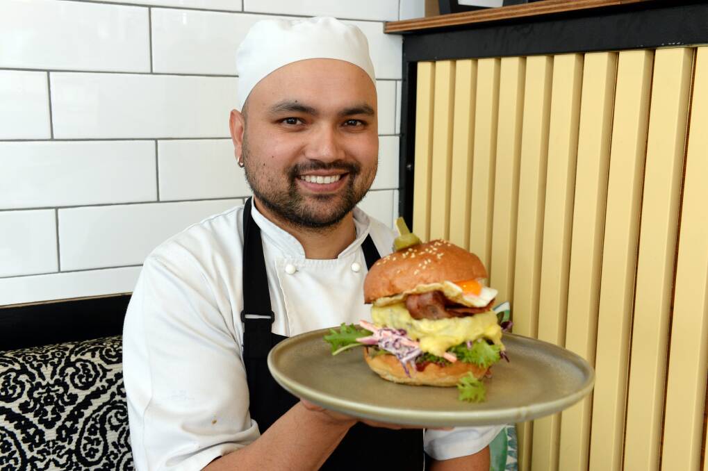 Feeling hungry?: Tin Roof's head chef Dinesh Pathak with his Wagyu creation for the Ballarat Burger Challenge. Picture: Kate Healy