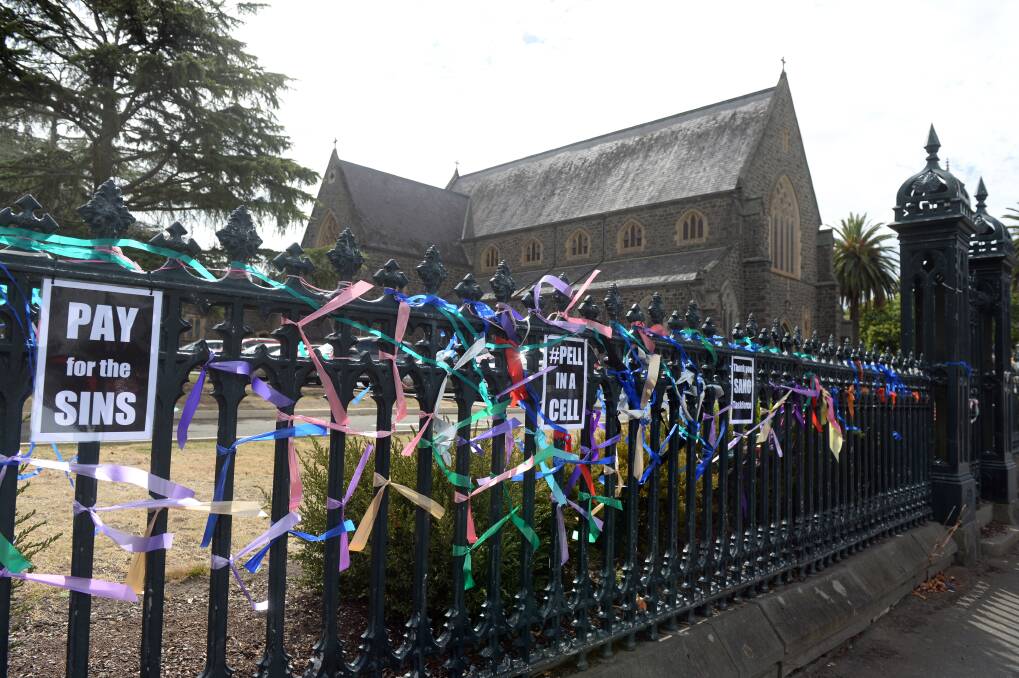 Anger: Signs appeared on St Patrick's Cathedral's fence on Wednesday. Picture: Kate Healy