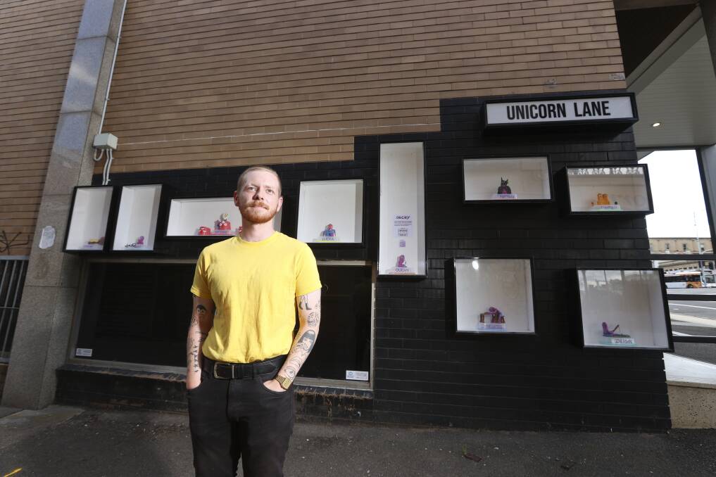 On show: Christopher Risk in front of his 'Ouchies' outdoor exhibition on Unicorn Lane. Picture: Luke Hemer