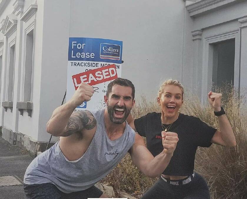 Taite Radley and Ali Oetjen with the leased sticker. Picture: Instagram