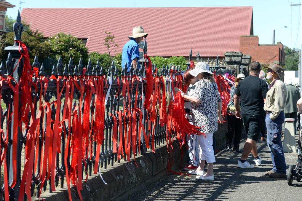 Ribbons are tied to a fence at St Paul's Anglican Church. Picture: Kate Healy