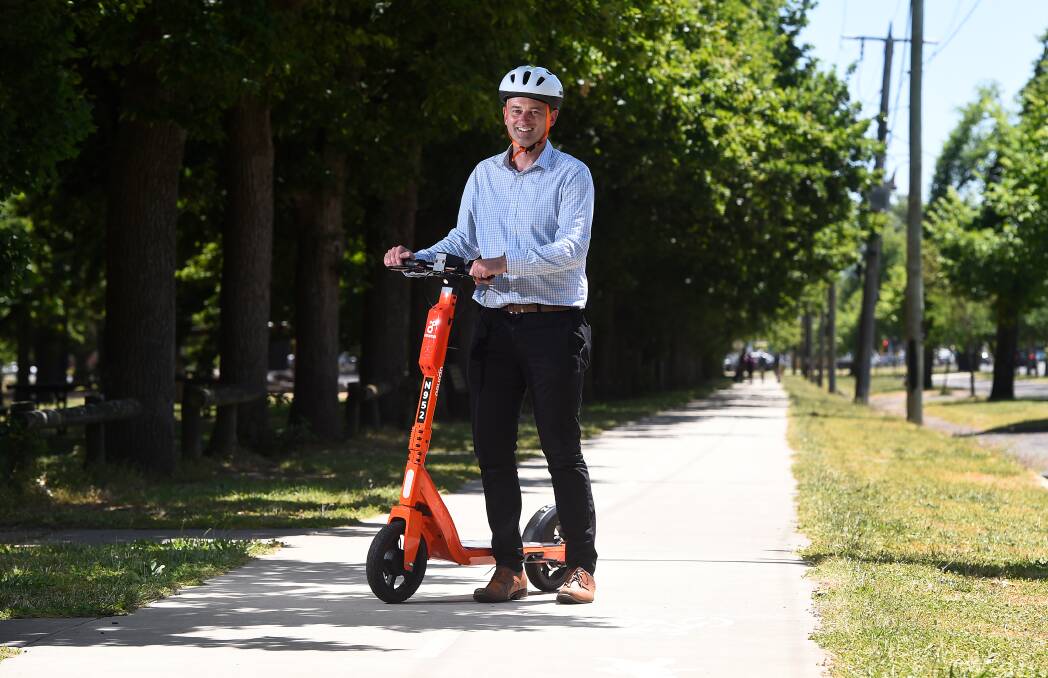 Mayor Daniel Moloney with a Neuron e-scooter. Picture: Adam Trafford