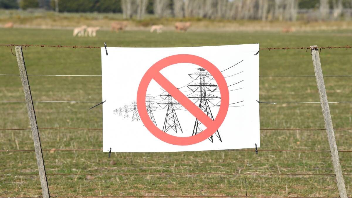 An anti-powerline sign spotted on a fence north of Ballarat. Picture: Kate Healy