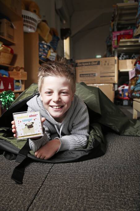 11-year-old Jake Sbardella with one of his first advent calendars. Picture: Luka Kauzlaric