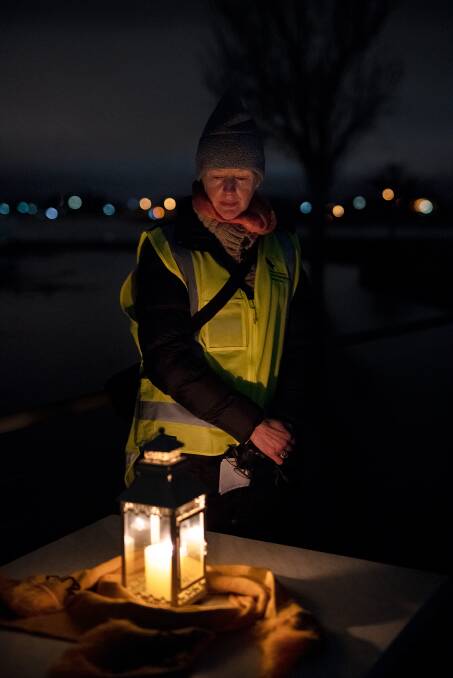 Lifeline Ballarat manager and Ballarat and District Suicide Prevention Network deputy chair Michelle MacGillivray lights a candle to remember the lives lost to suicide