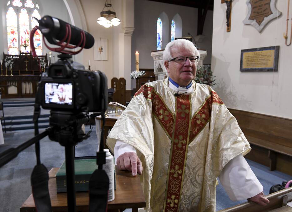 Father Reynolds led streamed church services during 2020's lockdowns. Picture: Lachlan Bence