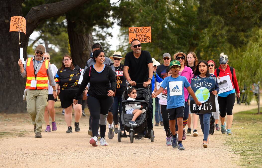 On the march: Families were part of the Walk Against Warming around Lake Wendouree on Sunday. Picture: Adam Trafford