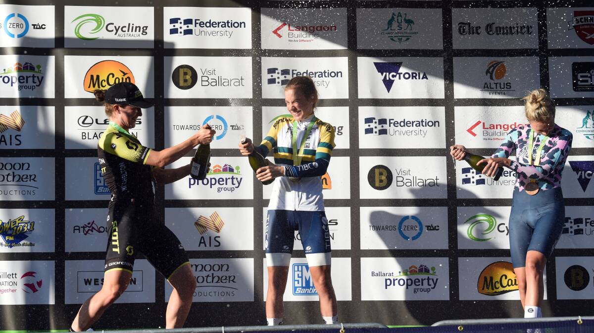 Sarah Gigante (centre) celebrates her time trial win last year with Grace Brown and Emily Herfoss. Picture: Kate Healy