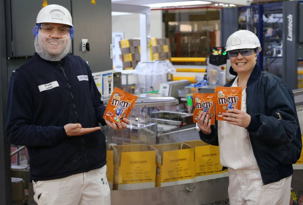 Brand new: Brock Lyons and Jacinta Ray at the Ballarat Mars factory with the pretzel M&Ms. Pictures: contributed