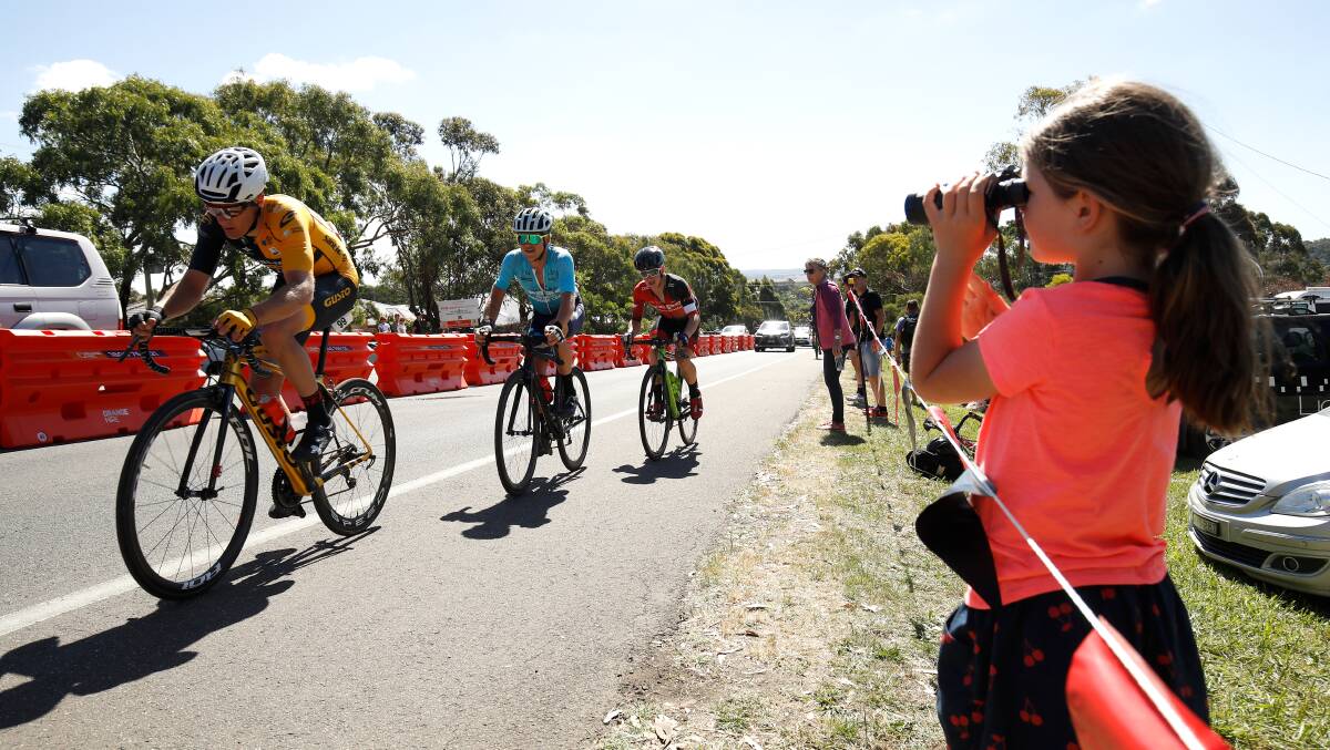 Seven-year-old Annalise Milostic watches the riders go by near the Mt Buninyong Road turnoff on Sunday. Picture: Adam Trafford