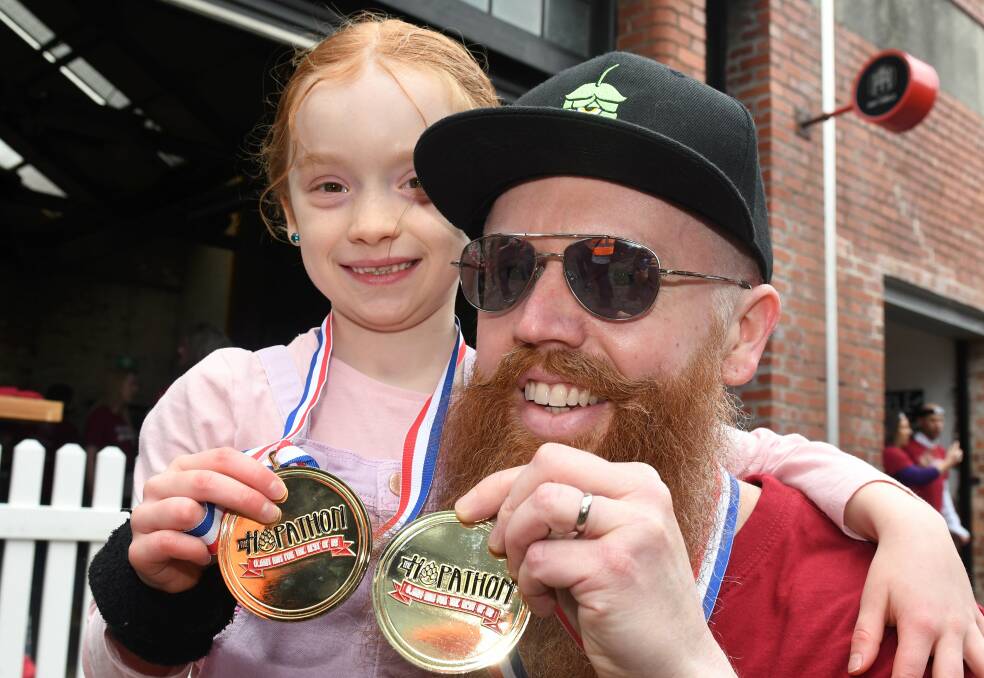 7-year-old Greta and Adam Cameron after the run. Pictures: Lachlan Bence