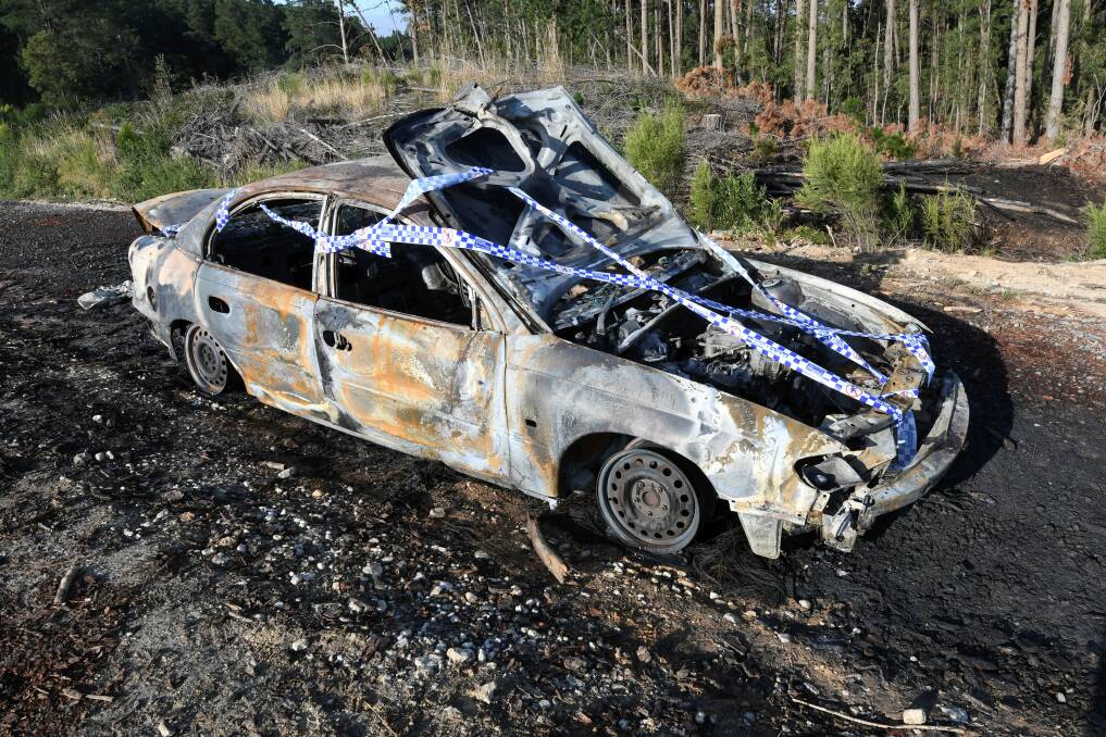 The burnt-out car on Frenchmans Lane. Picture: Lachlan Bence