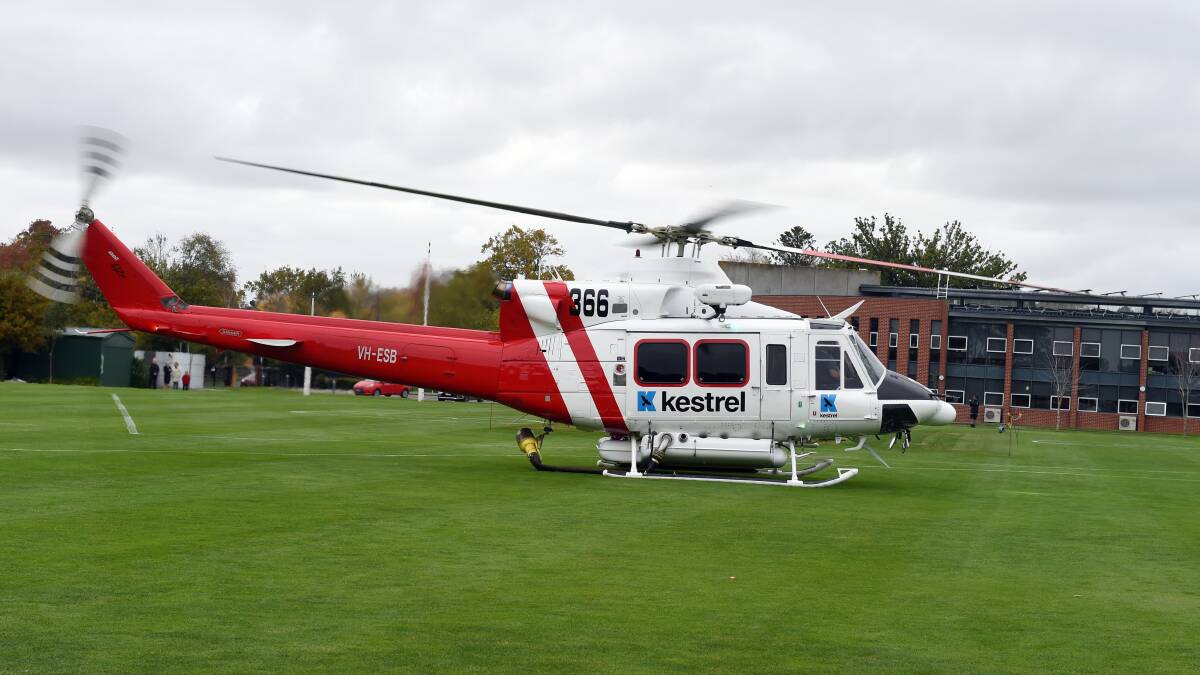 A Kestrel Bell 412 lands on the oval. Picture: Kate Healy