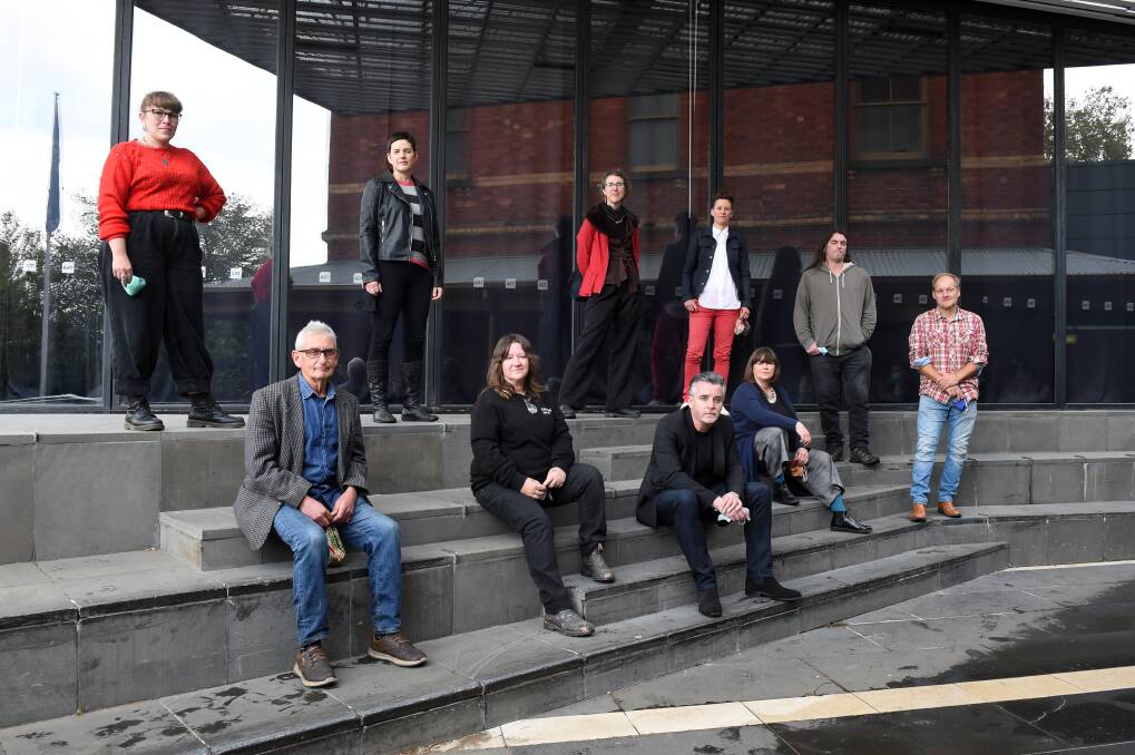 Finding a voice: Artists in the Continuous Voices project (back, from left) Paige Duggan, George Williams, Eliza-Jane Gilchrist, Michelle Dunn and Glenn Pearce, (front) Geoff Hassall, Kaff-eine, James Money, Rebecca Russell and Robbie House. Picture: Kate Healy
