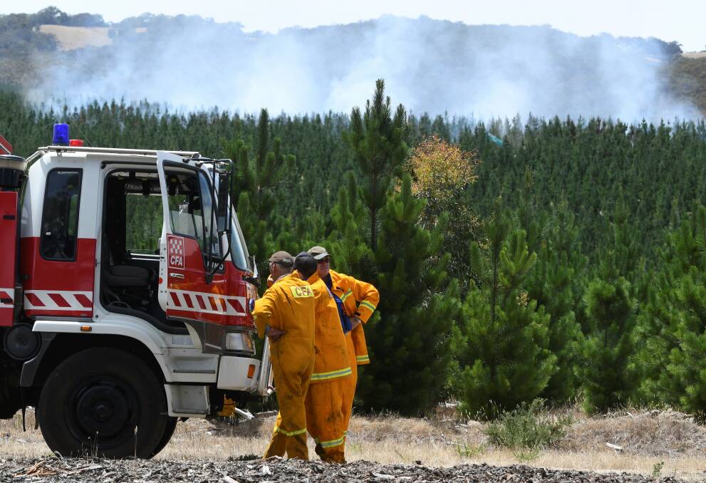 Ready: CFA firefighters at the fire near Linton on Thursday. Pictures: Lachlan Bence