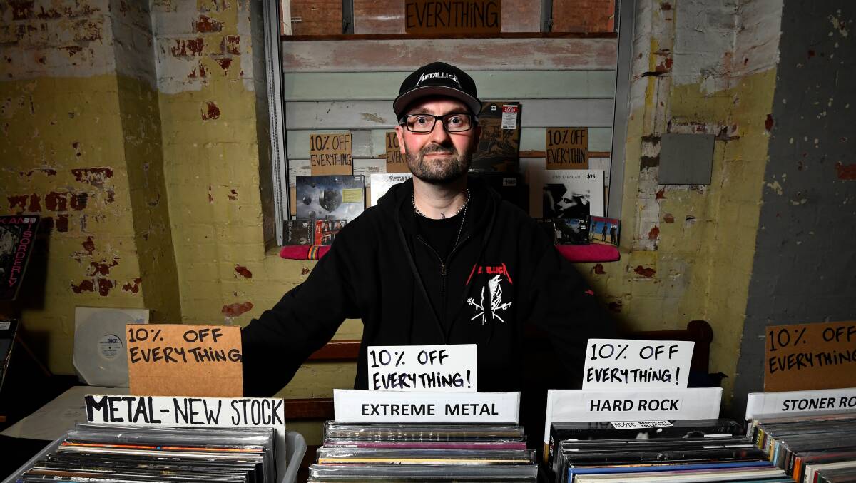 Rob Walmsley with his collection of metal records.