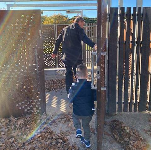 Charlie Joyce follows a council officer into the Victoria Park playground. Pictures: Courtney Rodda