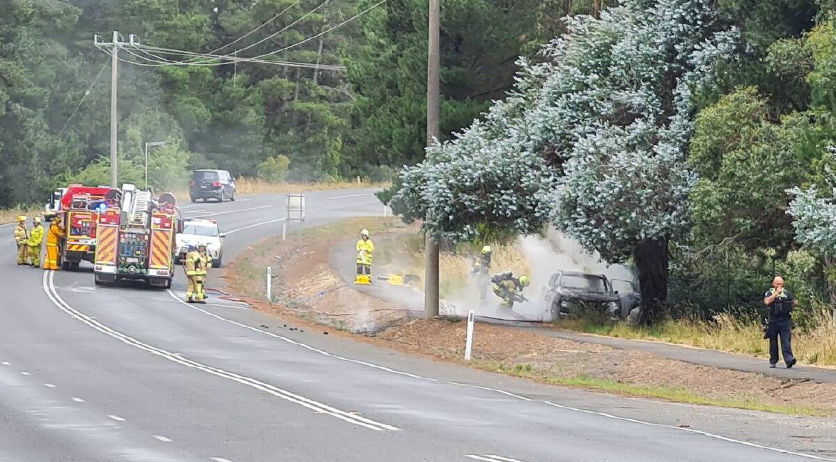 Fire crews extinguish a car on fire on Whitehorse Road in Mount Clear. Picture by The Courier