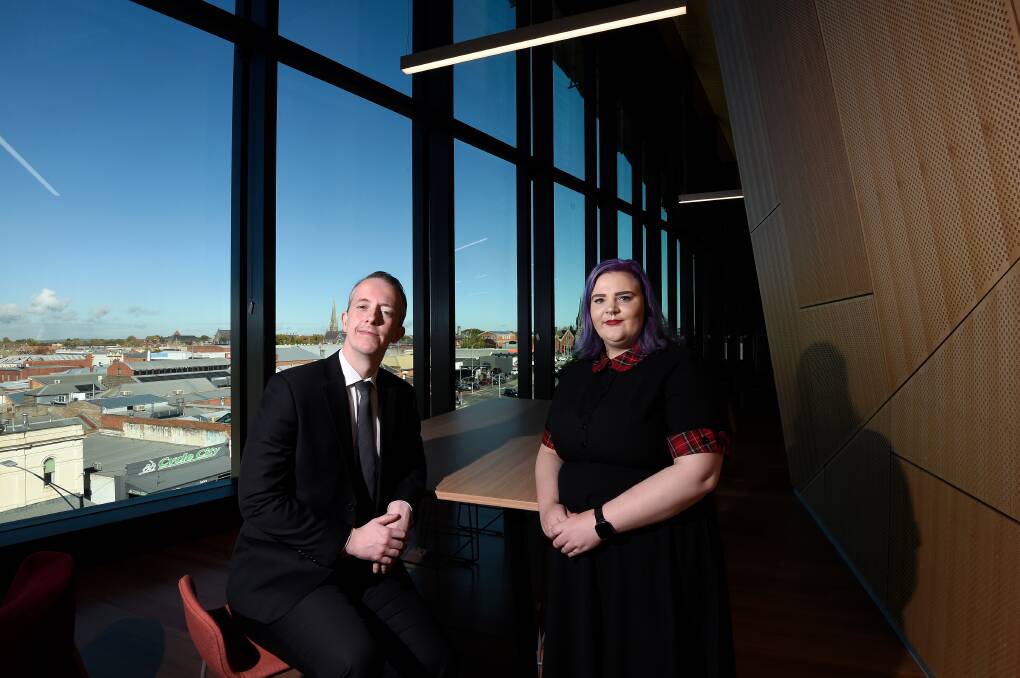 Quite a view: New Ballarat residents and GovHub employees Nick Eaton and Daisy O'Keefe on GovHub's top floor. Picture: Adam Trafford