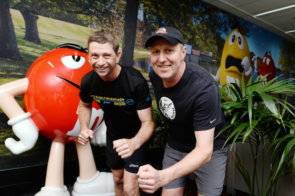 SUGAR RUSH: Mars employees Andrew Torney and John Walsh are ready for Run for a Cause next Sunday. Picture: Kate Healy