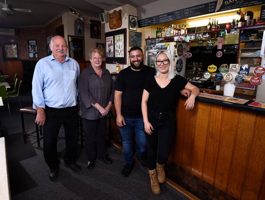 Peaceful transfer of power: The Royal Oak's John and Karen Turner with new owners Dean Mangion and Gigi Milone. Picture: Adam Trafford