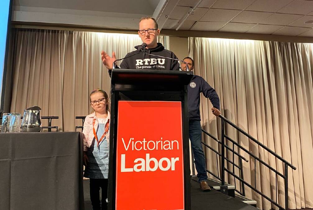 Ballarat Alstom worker Luke Cornish speaking at the state ALP conference with his daughter on Saturday. Picture: contributed