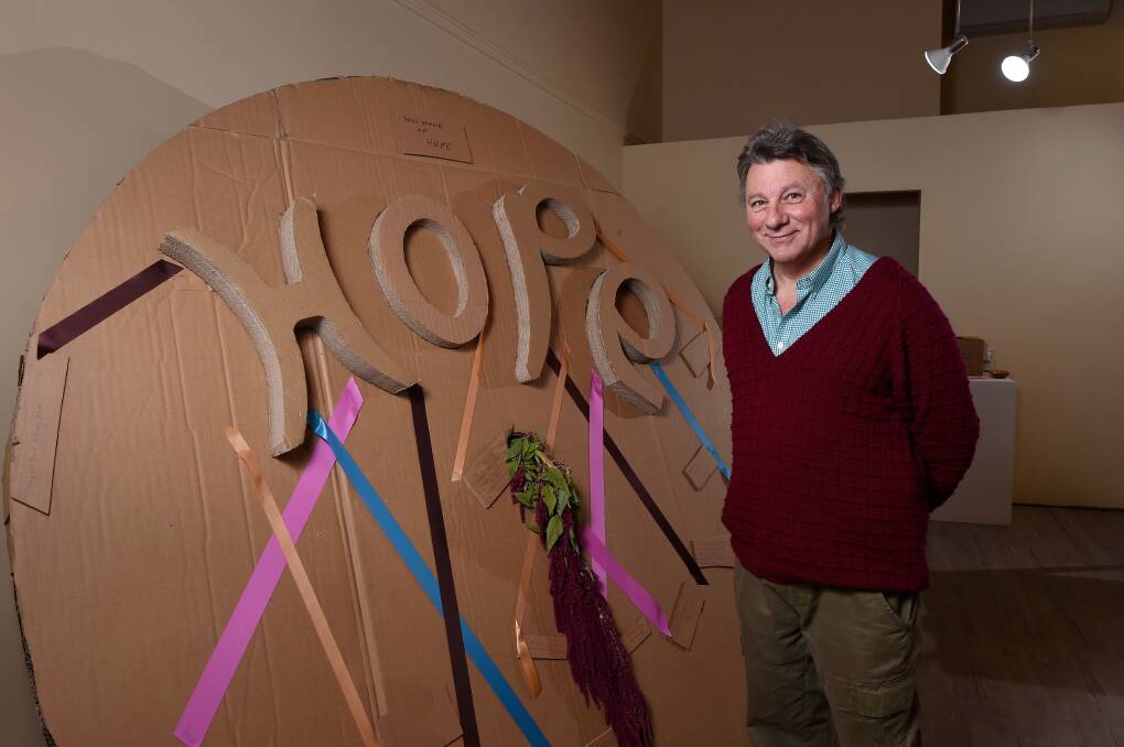 Response: Trevor Coad with his Millstone of Hope sculpture. Pictures: Adam Trafford