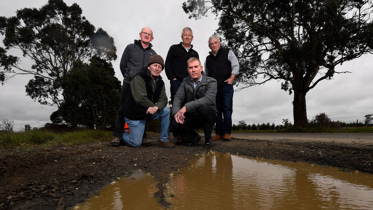 Millbrook residents Gerard White, Neil Leonard and Mark Weigall with Moorabool Shire's asset and infrastructure manager Phil Jeffrey and mayor Paul Tatchell. Picture: Adam Trafford