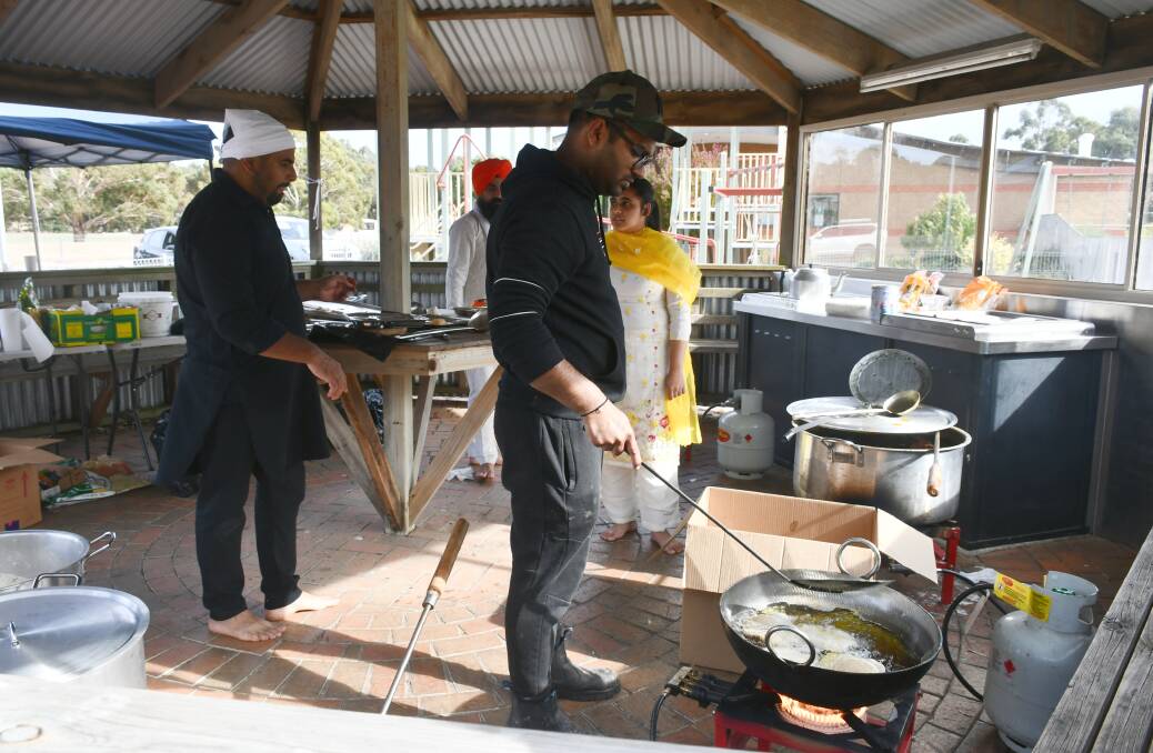 Volunteers cook up food for the Vaisakhi celebration - one of the key tenets of the Sikh faith is to make sure "no one goes to sleep hungry"