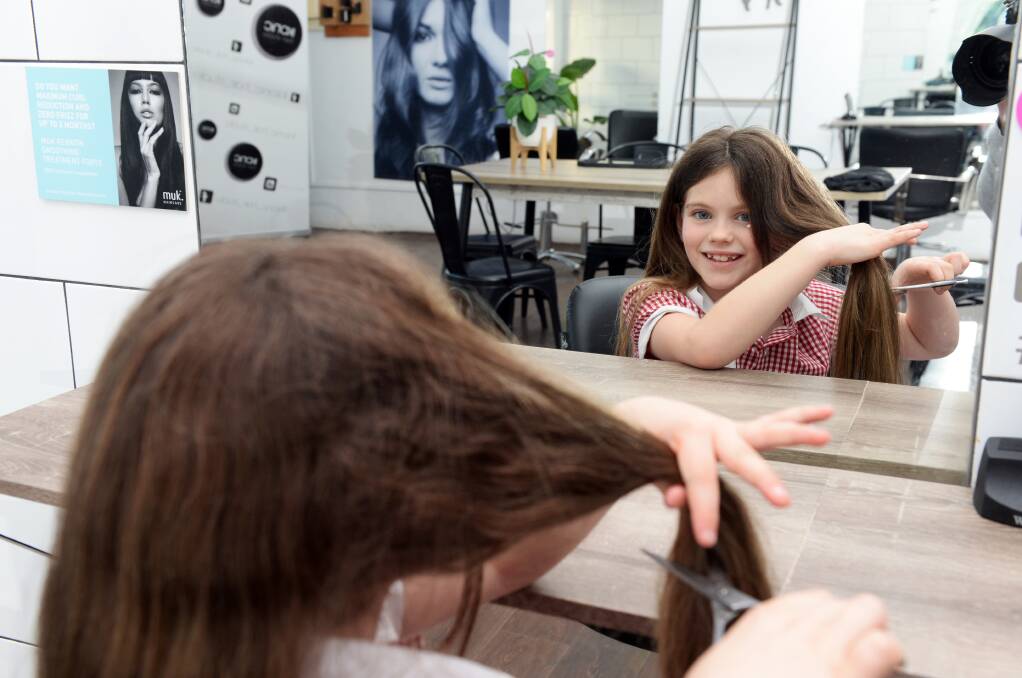 Helping out: Seven-year-old Ruby McLure will donate her locks to Wigs 4 Kids, to help children recovering from cancer treatment. Picture: Kate Healy