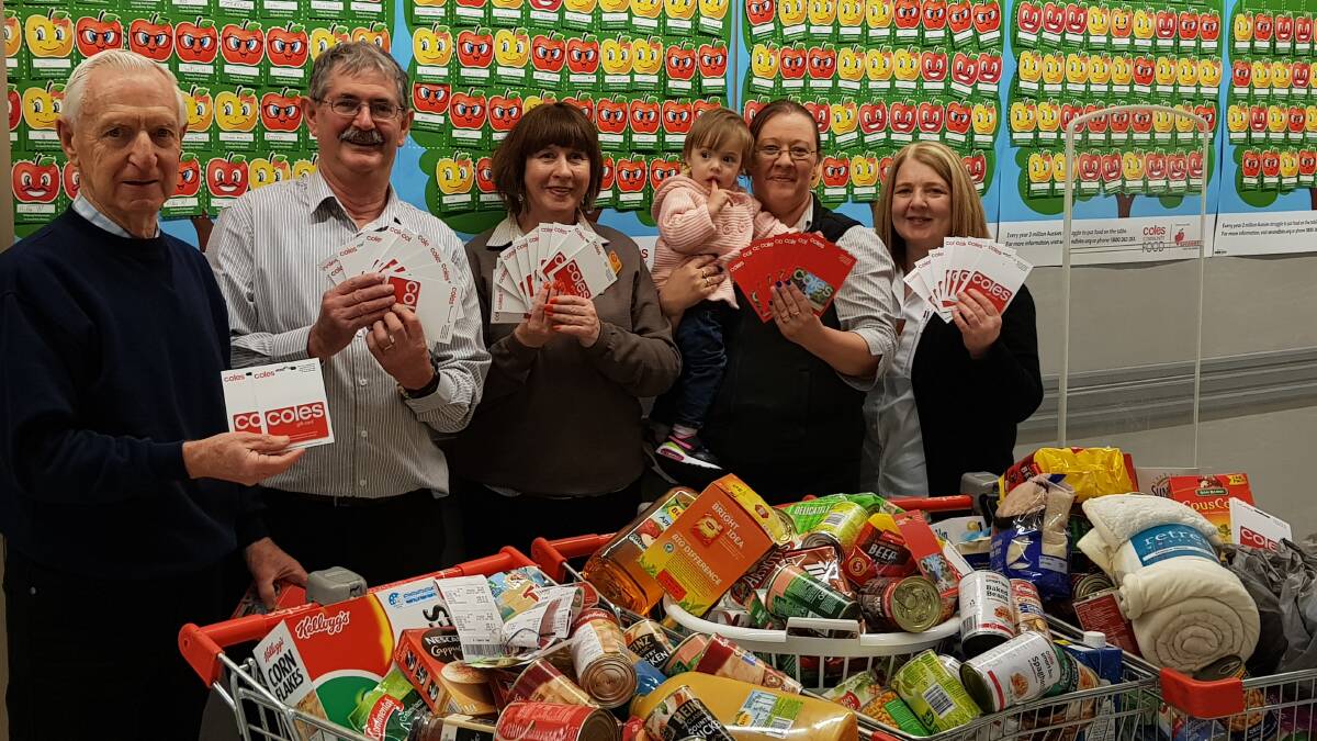 GOOD CARDS: Appeal director Peter Caligari with Coles staff Sharne Horsburgh, Joy Wolstenholme, Toni Ashmore and Sharon Germon. Picture: provided. 