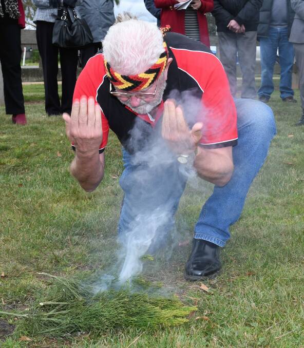 Celebration: An Indigenous smoke ceremony is performed at the official opening of the Miners Rest Community Park on Tuesday, to celebrate the completion of the revitalisation project. Picture: Lachlan Bence