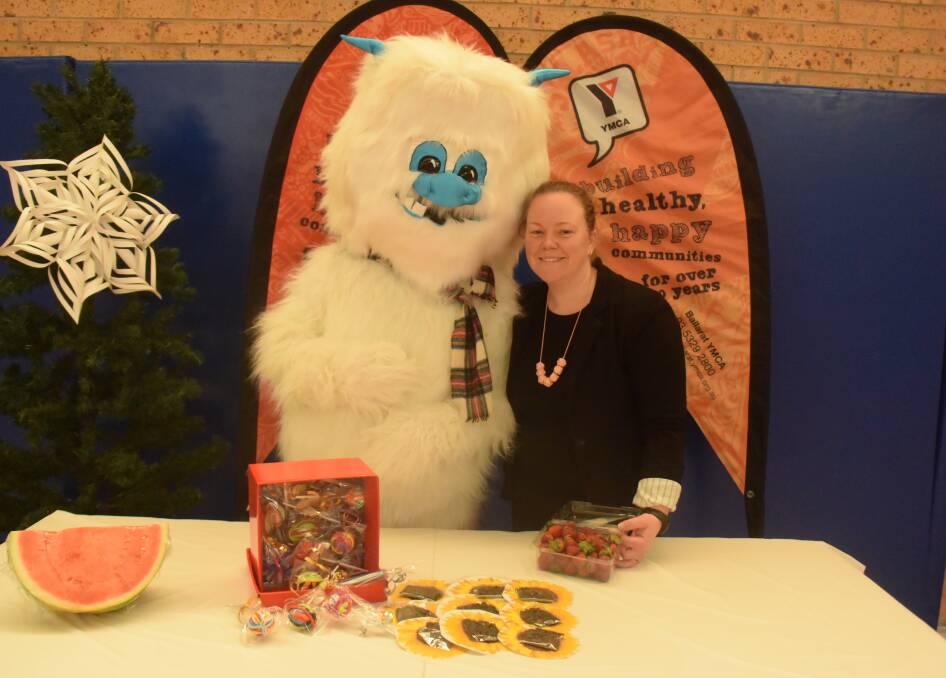WinterFest: The Yeti, who is waiting for a name, with YMCA Director of Community Youth and Engagement Stacy Oliver preparing for the 2017 YMCA WinterFest market. 