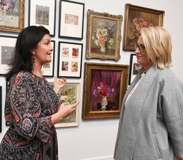 Flower power: Ballarat mayor Samantha McIntosh and Melbourne lord mayor Sally Capp on Saturday at the Art Gallery of Ballarat. Picture: Lachlan Bence