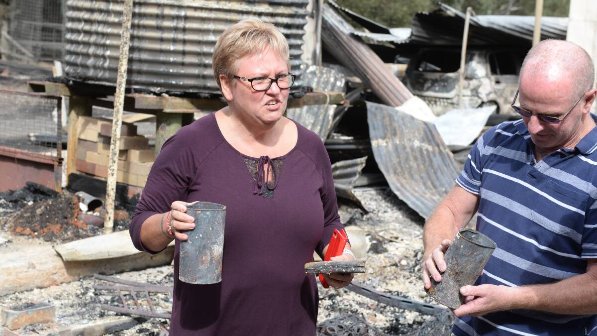 Heather Armstrong holds remaining pieces from her mother's home in Bunkers Hill. Picture: Kate Healy