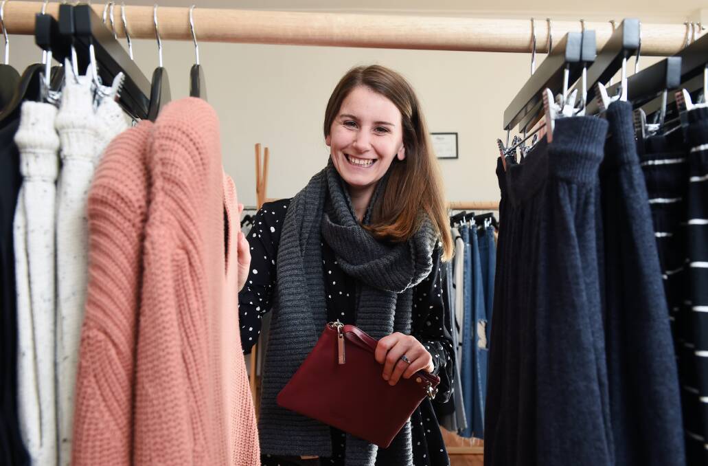Winter warmer: Sarah Kirby of clothing boutique Lola & May prepares for Sunday's Boutique Market at the Ballarat Mining Exchange. Picture: Kate Healy